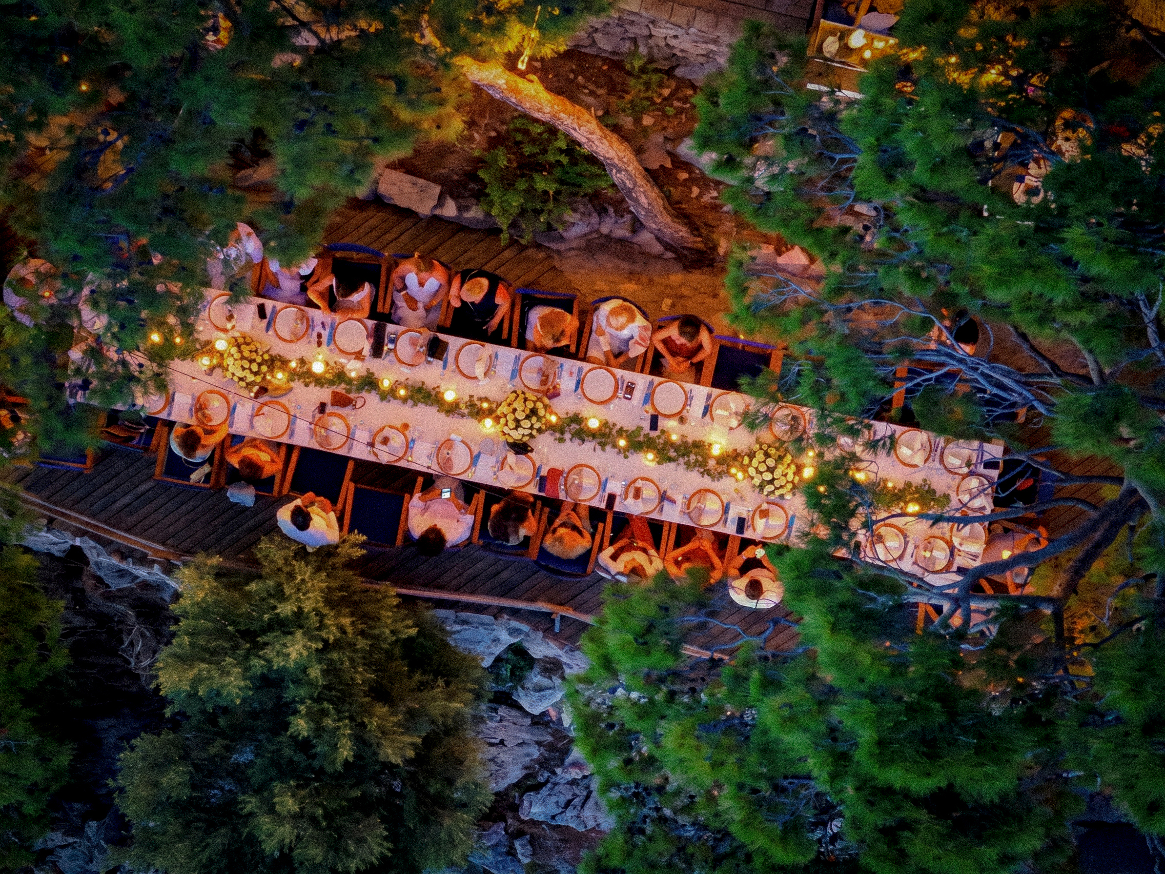 Candlelit tables under the night sky at Perdue