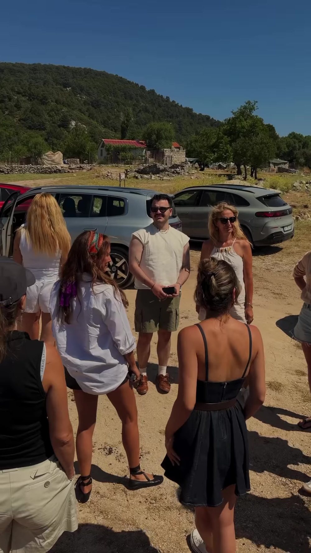 Guests gathered by the cars between drives