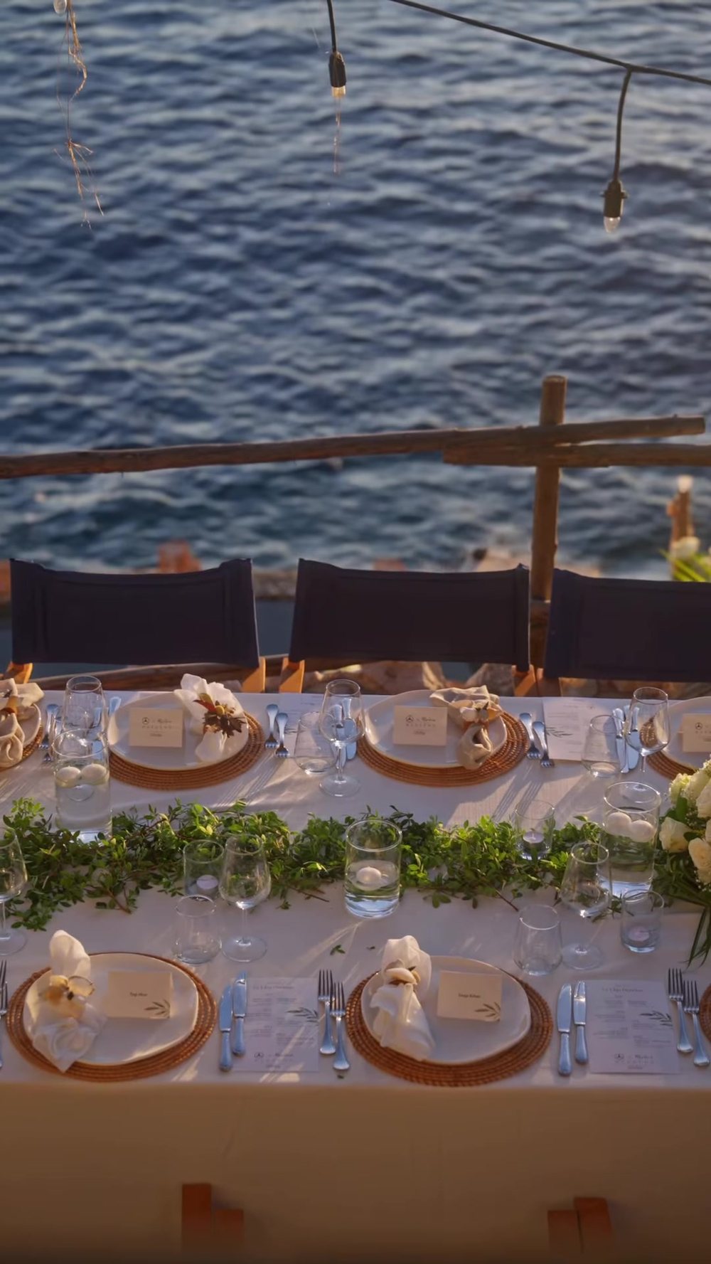 A long table set by the sea