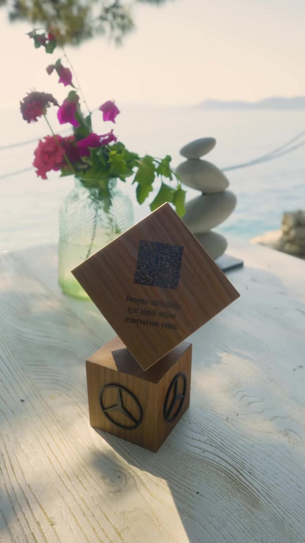 A table marker by the sea